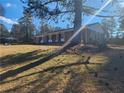 Brick ranch home with mature trees and landscaping at 4129 Pepperdine Dr, Decatur, GA 30034