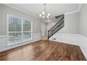 Bright dining room with hardwood floors and chair railing at 1238 Sandy Creek Rd, Fayetteville, GA 30214