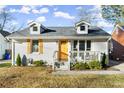 Charming home featuring yellow shutters, yellow front door and landscaped yard at 2458 Lynn Iris Dr, Decatur, GA 30032