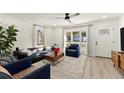 Cozy living room with lots of light, stylish seating, rug and hardwood floors at 2458 Lynn Iris Dr, Decatur, GA 30032