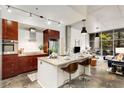 Contemporary kitchen featuring an island with counter seating, granite countertops, and modern appliances at 130 Arizona Ne Ave # 104, Atlanta, GA 30307