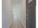 The home's foyer has light gray walls, white trim, and a light wood floor at 691 Sunstone Ln, Lawrenceville, GA 30043