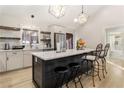 Modern kitchen with an island, stainless steel appliances, and bar stool seating for a cozy design at 241 Hembree Drive, Canton, GA 30115