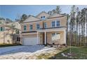 Two-story brick home with a white front door and attached garage at 121 Belvedere Rd, Mcdonough, GA 30253