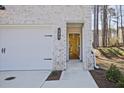 Close-up of the front entrance with a modern door and visible house number at 685 Sunstone Ln, Lawrenceville, GA 30043