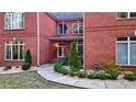 Charming front entrance with double doors and well-maintained landscaping, set in a red brick facade at 271 Brooks Rackley Rd, Dallas, GA 30157