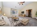 Spacious living room with vaulted ceilings, large windows, and stylish decor at 254 Cobblestone Ln, Mcdonough, GA 30252