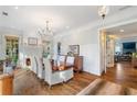 Elegant dining room with hardwood floors, chandelier, and fireplace at 6830 Vickery Creek Rd, Cumming, GA 30040