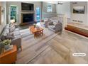 A bright living room boasts a brick fireplace, neutral furniture, and a staircase at 2007 Variations Ne Dr, Atlanta, GA 30329