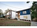 Modern two-story house with a stylish blue and white exterior at 1330 Lockwood Sw Dr, Atlanta, GA 30311