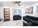 Bright living room featuring two sofas, a rug, and a world map print at 1330 Lockwood Sw Dr, Atlanta, GA 30311