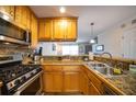 Well-lit kitchen with stainless steel appliances and granite countertops at 2232 Dunseath Ave # 407, Atlanta, GA 30318