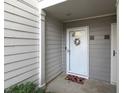 Inviting front door featuring a wreath and colorful welcome mat at 75 Fair Haven Se Way, Smyrna, GA 30080