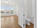 Small bathroom with toilet and hardwood floor at 625 Skytop Dr, Cumming, GA 30040