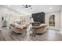 Inviting living room with a modern fireplace, wood flooring and a lot of natural light at 1312 Buttercup Ct, Lawrenceville, GA 30044