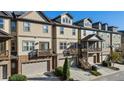 Exterior view of attractive townhomes, highlighting balconies and individual garages at 678 Emeril Dr, Avondale Estates, GA 30002