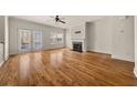 Bright living room with hardwood floors, fireplace, and access to a private balcony at 678 Emeril Dr, Avondale Estates, GA 30002