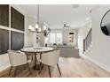 A dining room with art, hardwood floors, view of fireplace, and stairs at 4462 Lemon St # 2, Acworth, GA 30101