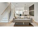 View of the open concept living room, dining room and kitchen area with hardwood floors and plenty of natural light at 4462 Lemon St # 2, Acworth, GA 30101