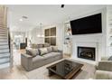Bright living room features a fireplace, built-in shelving, and an open floor plan at 4462 Lemon St # 2, Acworth, GA 30101