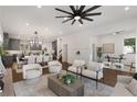 Spacious living room featuring hardwood floors, a stylish ceiling fan, and views of the kitchen at 60 Newcastle Sw St, Atlanta, GA 30314