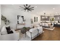 Cozy living room with hardwood floors, modern decor, and an open view into the dining area and kitchen at 60 Newcastle Sw St, Atlanta, GA 30314