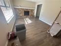 Living room with fireplace, wood-look flooring, and large window at 2656 Del Ridge Dr, Douglasville, GA 30135