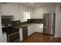 Kitchen features granite countertops and stainless steel appliances at 3251 Oakbrook Ln, Clarkston, GA 30021