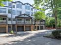 Desirable townhome featuring a covered front balcony, and convenient garages for each unit at 221 Semel Nw Cir # 273, Atlanta, GA 30309