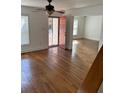 A bright living room boasts hardwood floors, a ceiling fan and a doorway to a secondary room at 333 Pickfair Sw Way, Atlanta, GA 30315