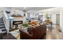 Open concept living room with fireplace, hardwood floors, and stylish decor at 1770 South Olympian Sw Way, Atlanta, GA 30310