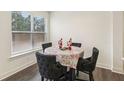 Charming breakfast nook with four chairs and window at 7621 Avalon Blvd, Fairburn, GA 30213