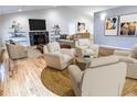 Spacious living room with hardwood floors, fireplace, and ample natural light at 5005 Dublin Dr, South Fulton, GA 30331
