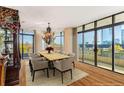 Dining area with a large wooden table, seating for eight, and floor to ceiling windows at 750 Park Ne Ave # 8E, Atlanta, GA 30326