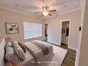 Bedroom featuring a ceiling fan, neutral color palette and two closets at 2005 Ocean Nw Dr, Atlanta, GA 30318
