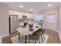 Eat-in kitchen featuring stainless steel appliances and white cabinetry at 2005 Ocean Nw Dr, Atlanta, GA 30318