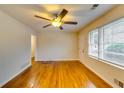 Hardwood floors and ceiling fan in bright living room at 4685 Ruby Ln, Forest Park, GA 30297