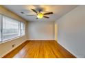 Hardwood floors and ceiling fan in bright living room at 4685 Ruby Ln, Forest Park, GA 30297