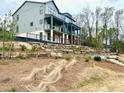 Beautiful light blue two-story home with a black fence in front of the backyard at 1995 Catnap Ct, Chamblee, GA 30341
