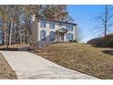 View of home and driveway, with two-car garage at 508 Sutters Mill Rd, Stone Mountain, GA 30087