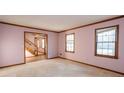 Spacious living room with hardwood floors and large windows at 714 Lanford Springs Sw Dr, Lilburn, GA 30047