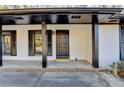Inviting front porch with black door and white brick exterior at 1900 Mornington Ln, Snellville, GA 30078