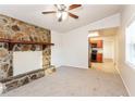 Open concept living room with kitchen view and fireplace at 3762 Elkridge Dr, Decatur, GA 30032