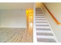 Modern staircase with wood and white risers, leading to the upper level at 1818 Ashborough Cir # E, Marietta, GA 30067