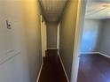 Hallway with wood floors leading to the bedrooms at 4597 Karla Cir, Conley, GA 30288