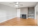 Cozy bedroom with hardwood floors, marble fireplace, and built-in shelving at 6851 Roswell Rd # I18, Sandy Springs, GA 30328