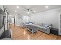 Spacious living room with hardwood floors and a comfortable sectional sofa at 6851 Roswell Rd # I18, Sandy Springs, GA 30328