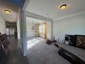 Cozy living room with bright windows, decorative trim, and neutral carpet at 330 Piedmont Cir, Covington, GA 30016