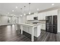 Spacious kitchen featuring an oversized island, stainless appliances, and white cabinetry at 4145 Essex Pond Way, Cumming, GA 30040