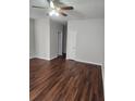 Bright and airy living room featuring new laminate floors, and a modern ceiling fan at 2438 Brianna Dr, Hampton, GA 30228